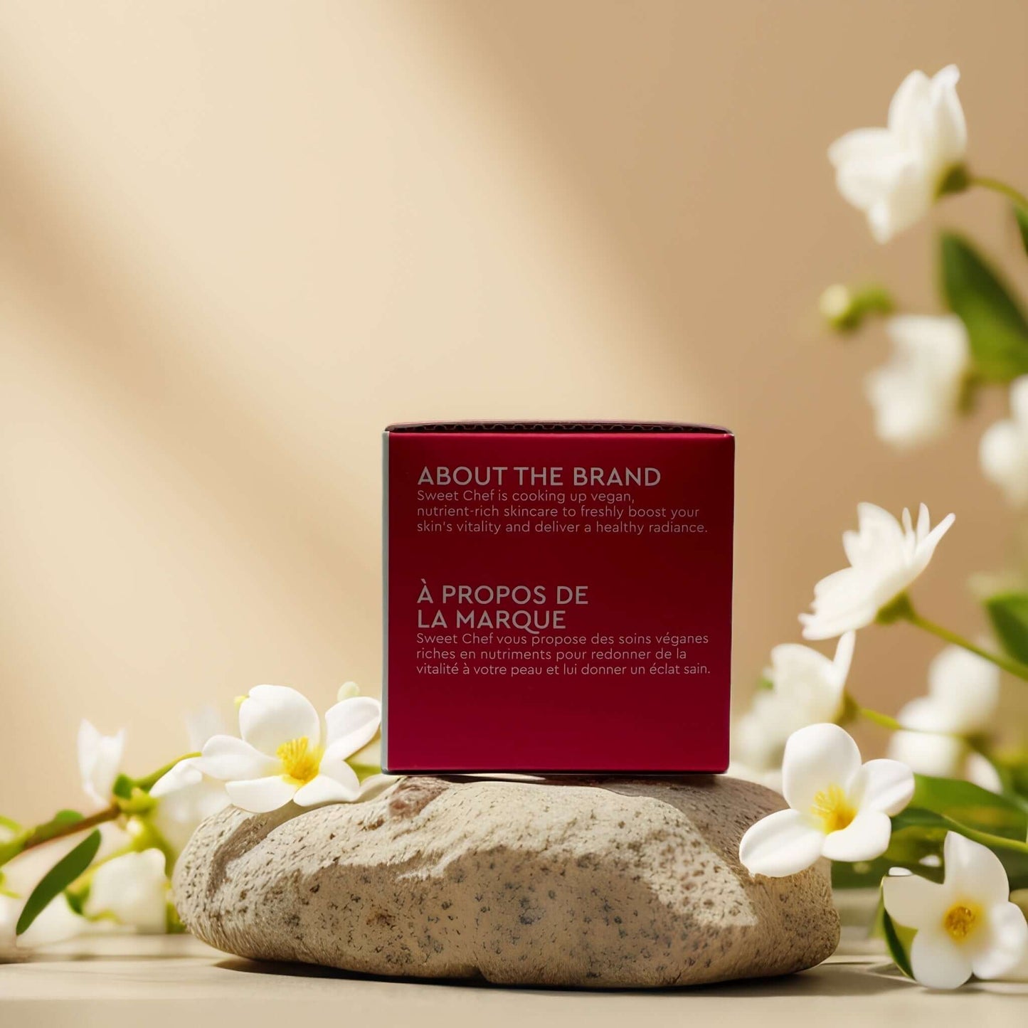 Sweet Chef brand overview box on a stone surface with flowers, highlighting skincare vitality and healthy radiance.