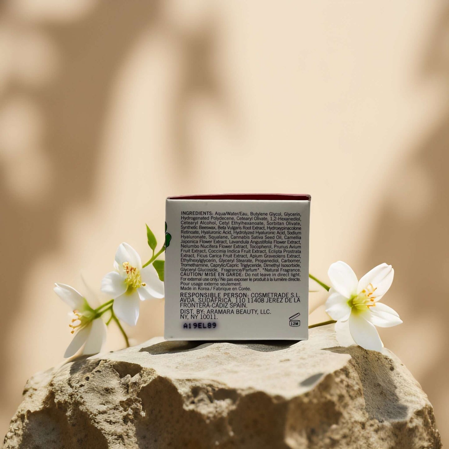 Firm & Smooth beet + retinol night mask product packaging with ingredients and flowers on a rock background.