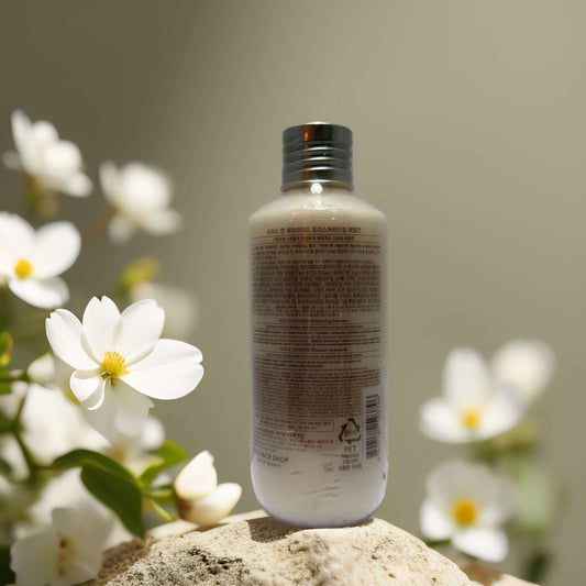 Lightweight Hydration Rice Ceramide Emulsion bottle with flowers, offering buildable hydration and skin barrier support.