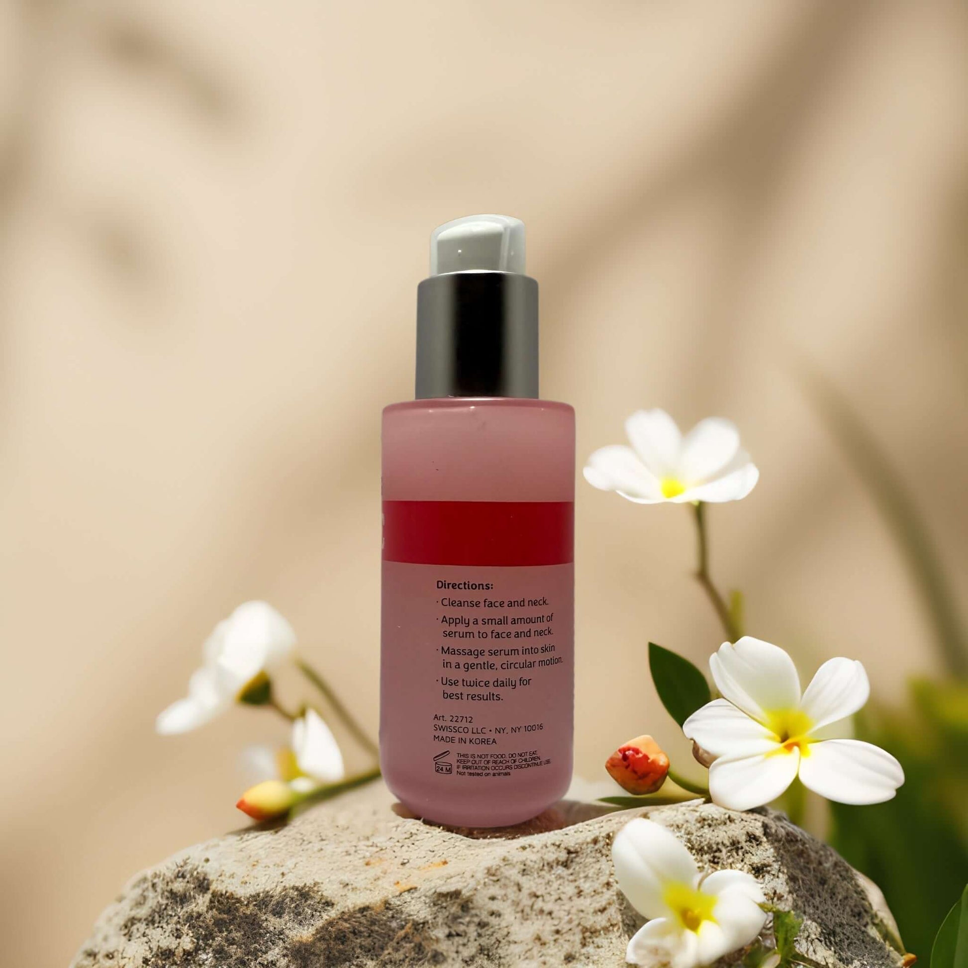 Tone + Glow Vitamin C Face Serum bottle with floral accents, promoting brightening and skin tone correction.