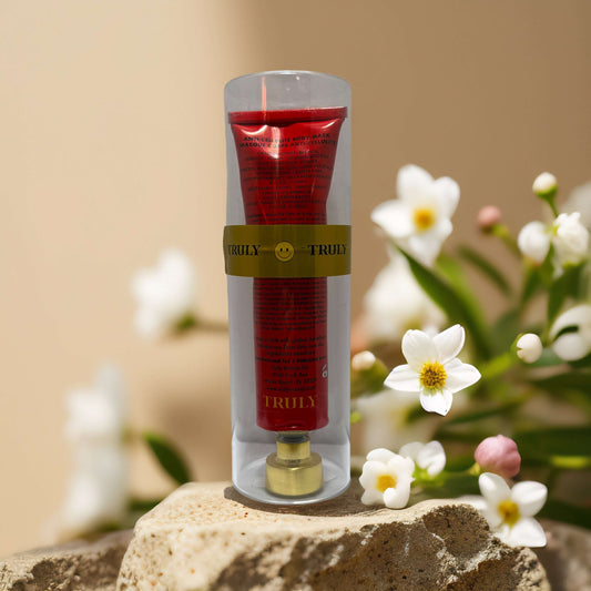 Smooth & Firm Anti-Cellulite Body Mask by Truly in red tube with floral background, 3 fl oz.