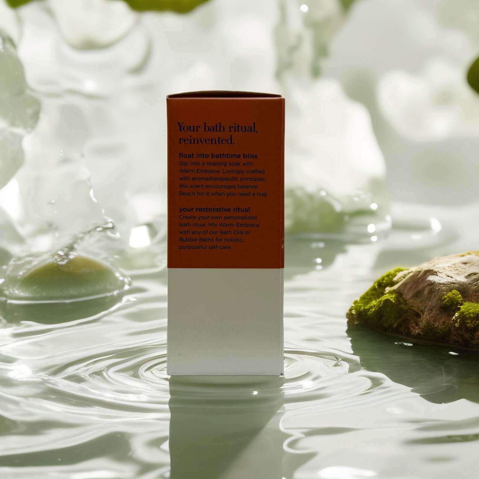 Body Boost Bath Oil Rose Geranium packaging in serene setting