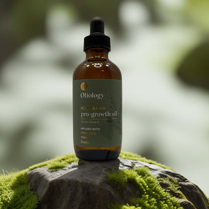 Oliology Pro-Growth Hair & Scalp Oil bottle on moss