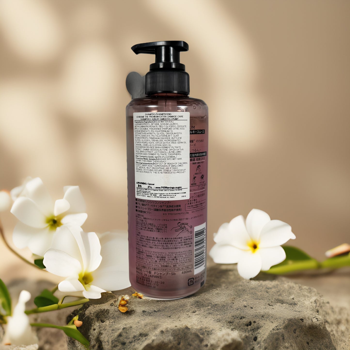 Silky Smooth & Damage Care | Ichikami Premium Shampoo by Kracie – 480ml bottle with a pump, surrounded by flowers.