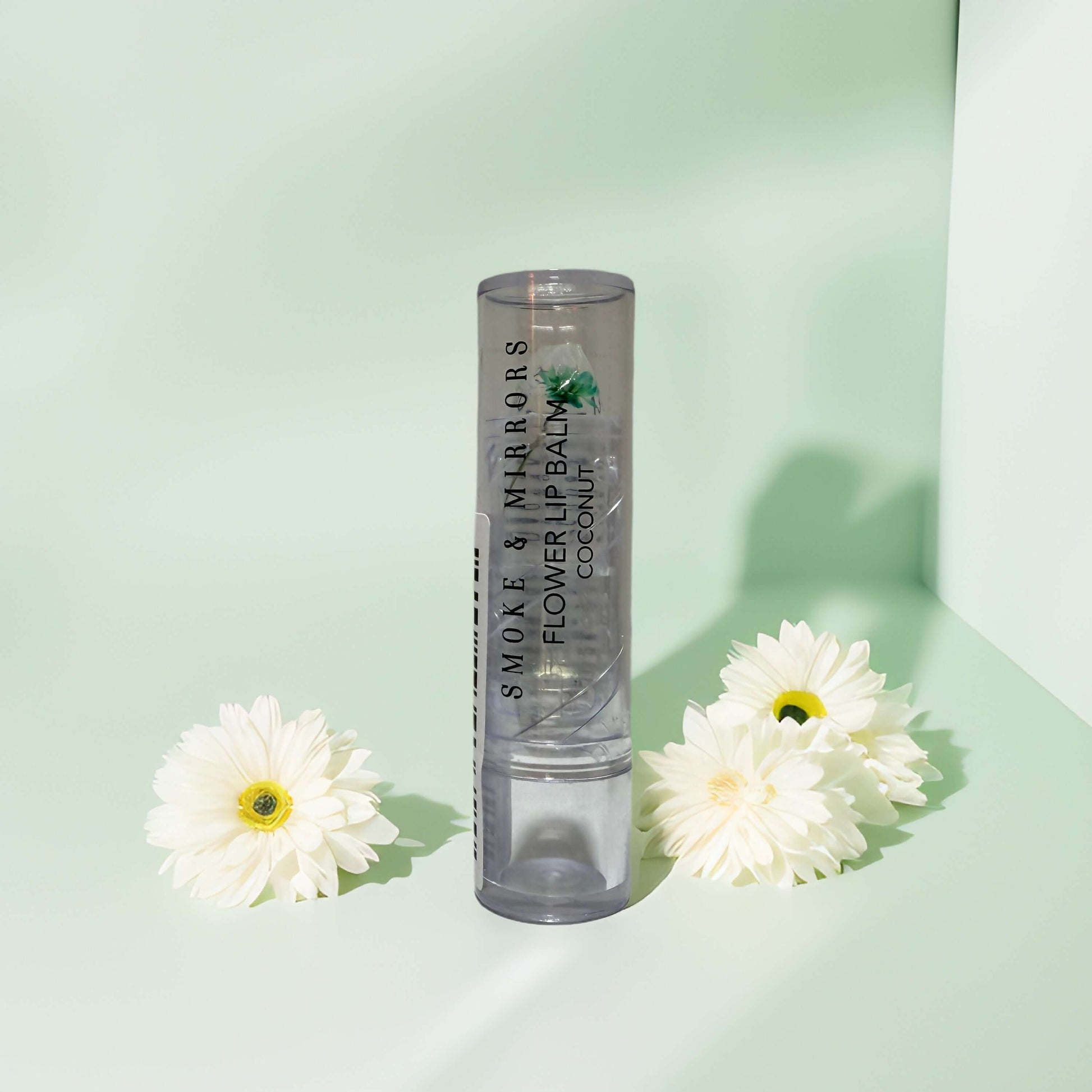 Clean beauty lip balm in eco-friendly packaging with flowers