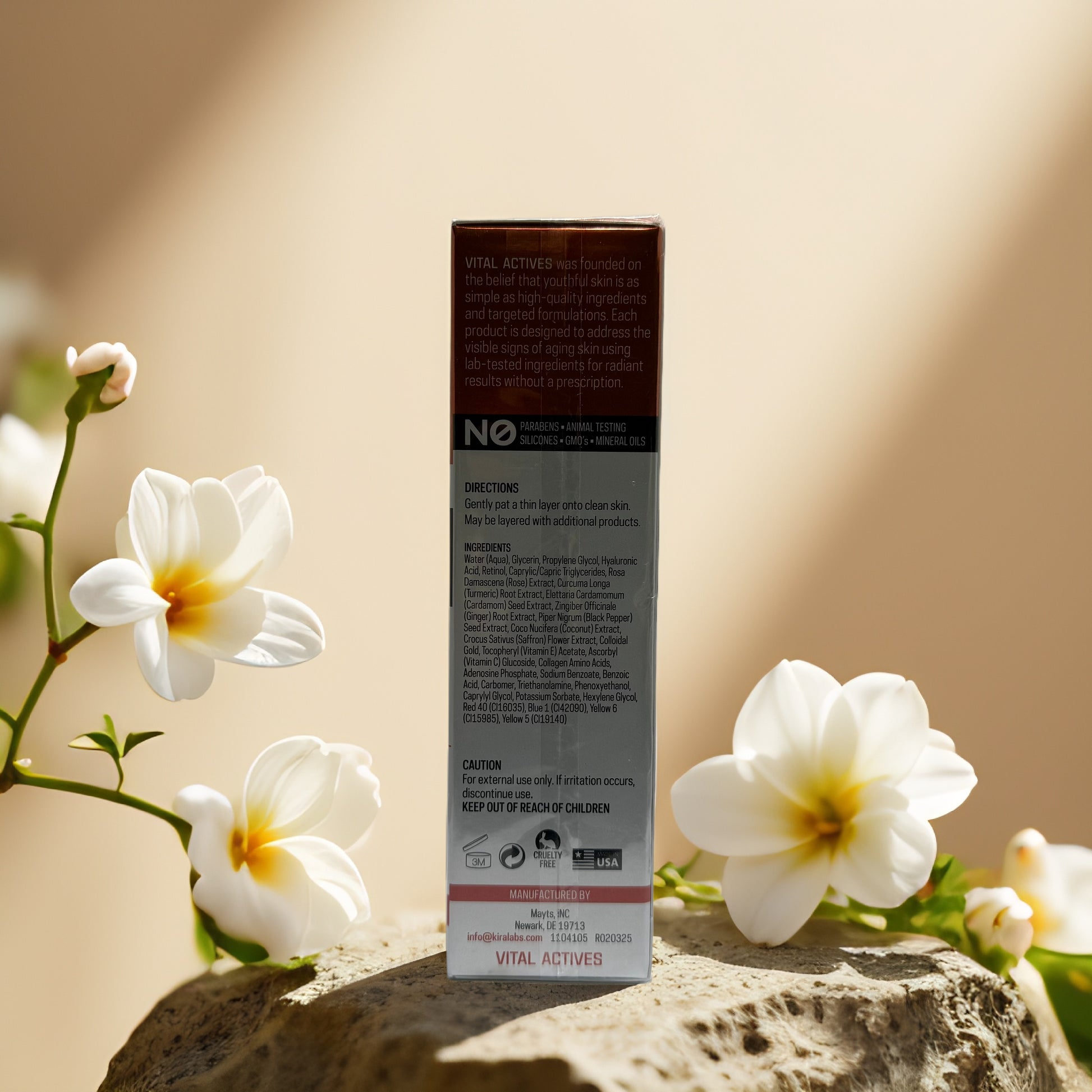 Back of Lift & Brighten serum box with floral accents and usage directions.