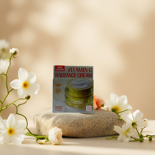 Brighten & Hydrate Vitamin C Radiance Cream by Tenzero with green tangerine extract, surrounded by flowers.
