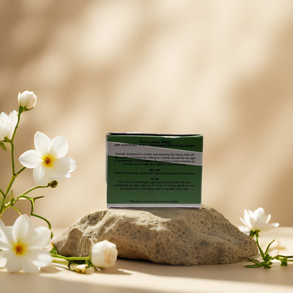 REN Clean Skincare Evercalm Rescue Mask packaging with flowers on a stone background.
