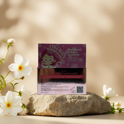 Esfolio Collagen Hydrogel Eye Patch box on a stone with flowers, designed to reduce puffiness and fine lines.