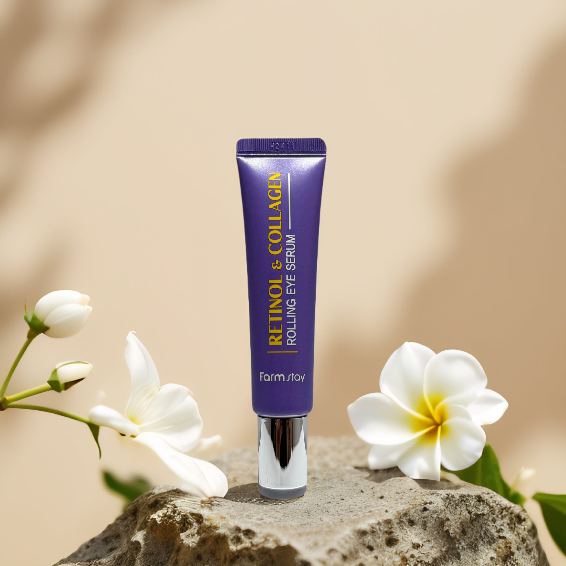 Retinol Collagen Rolling Eye Serum by Farm Stay in a tube with white flowers, reducing puffiness and fine lines.