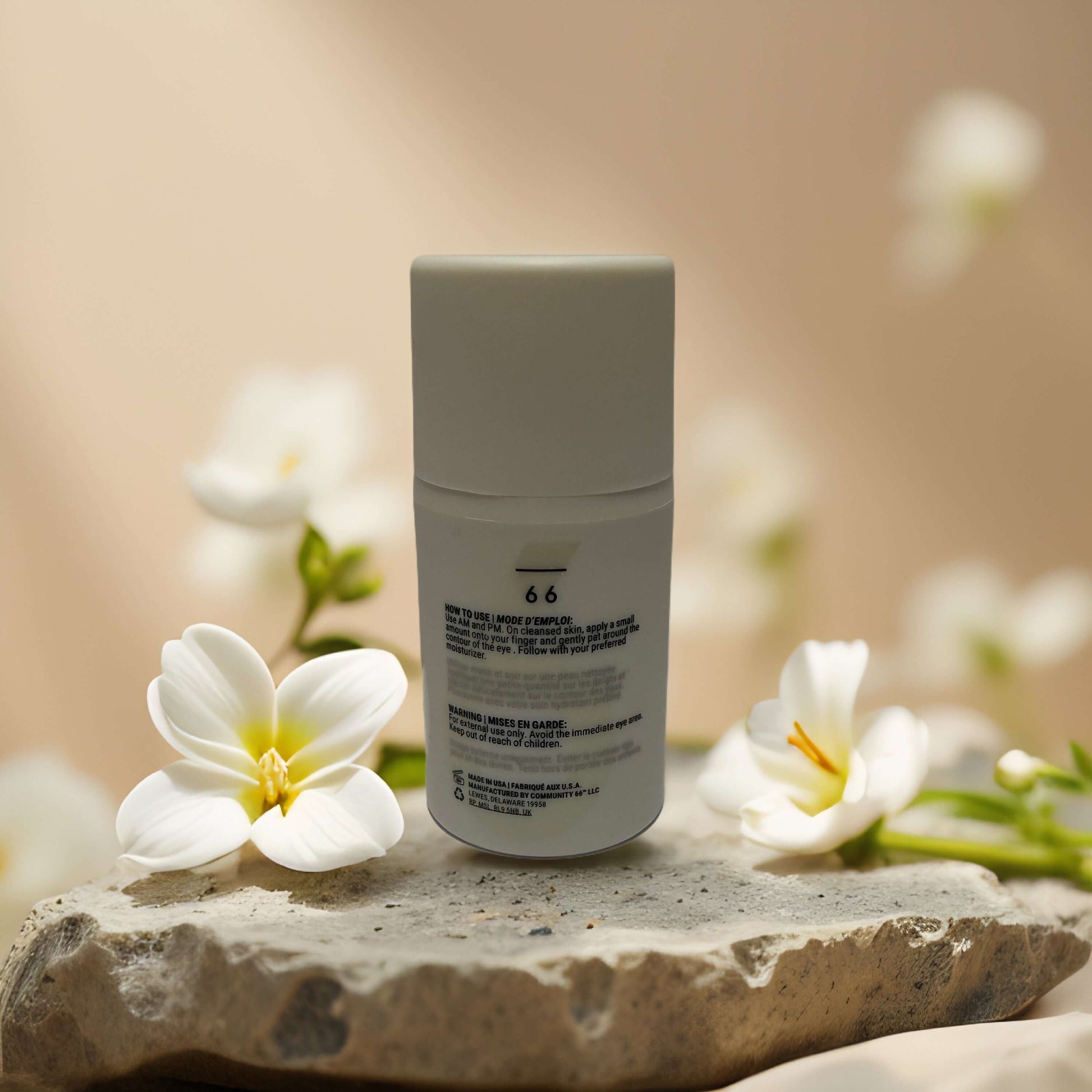 Bright-Eyed Boost hydrating eye cream by Community Sixty-Six with floral decor, showcasing its sleek packaging.