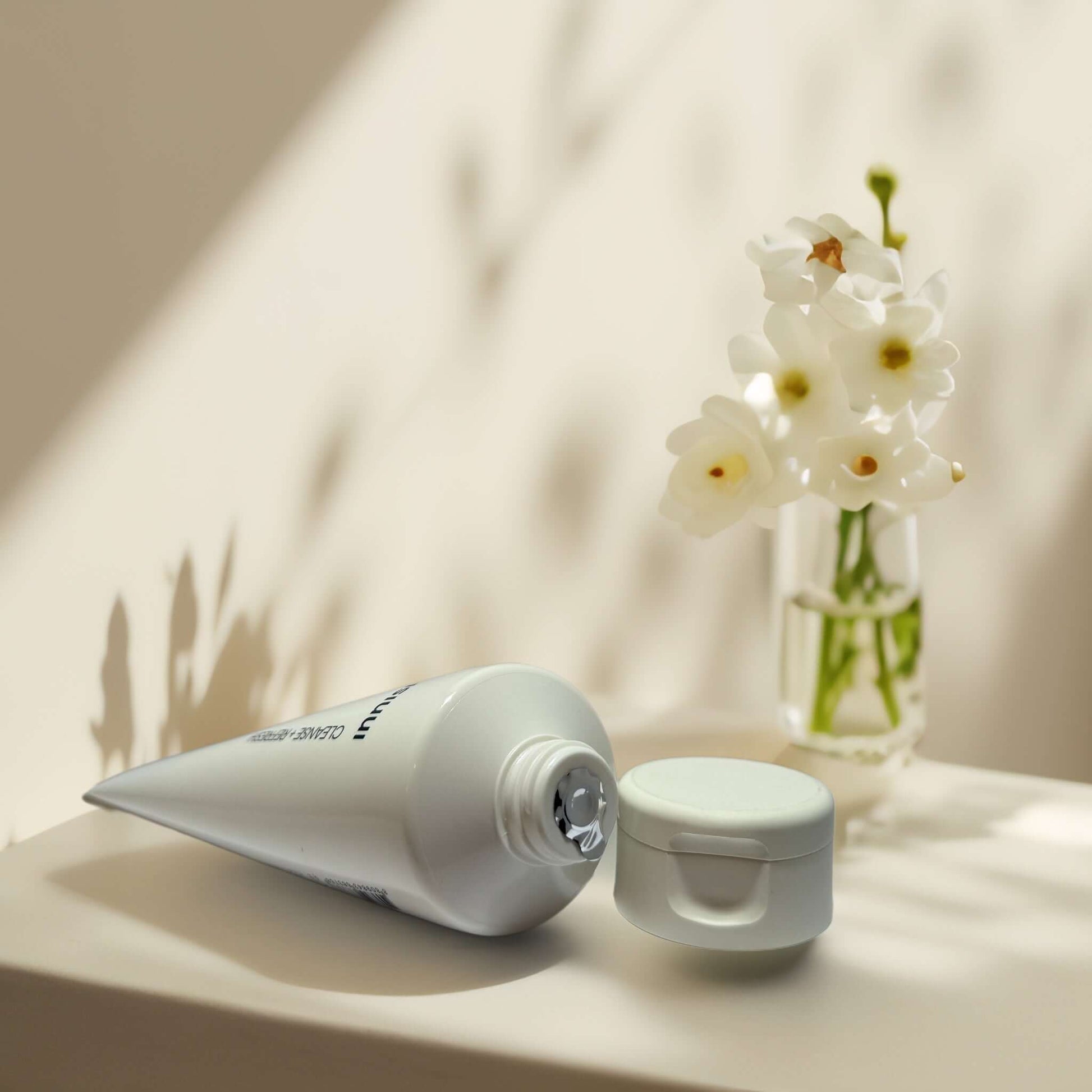 Innisfree Forest for Men Black Yeast Foam and flowers in vase.