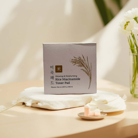 KYULGOUN Rice Niacinamide Toner Pads box on a soft backdrop