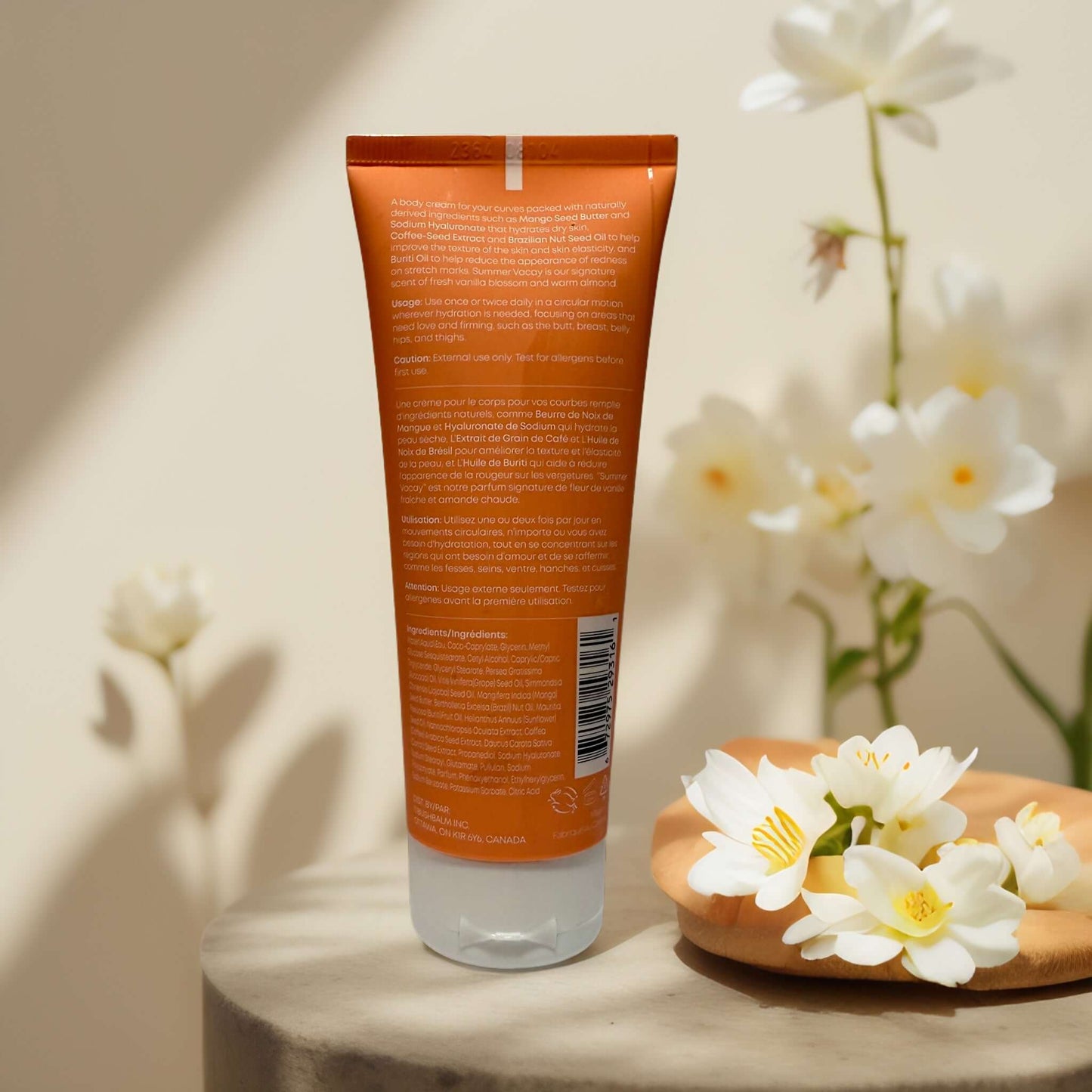 Back view of Bush Balm Curve Cream tube with floral decor.