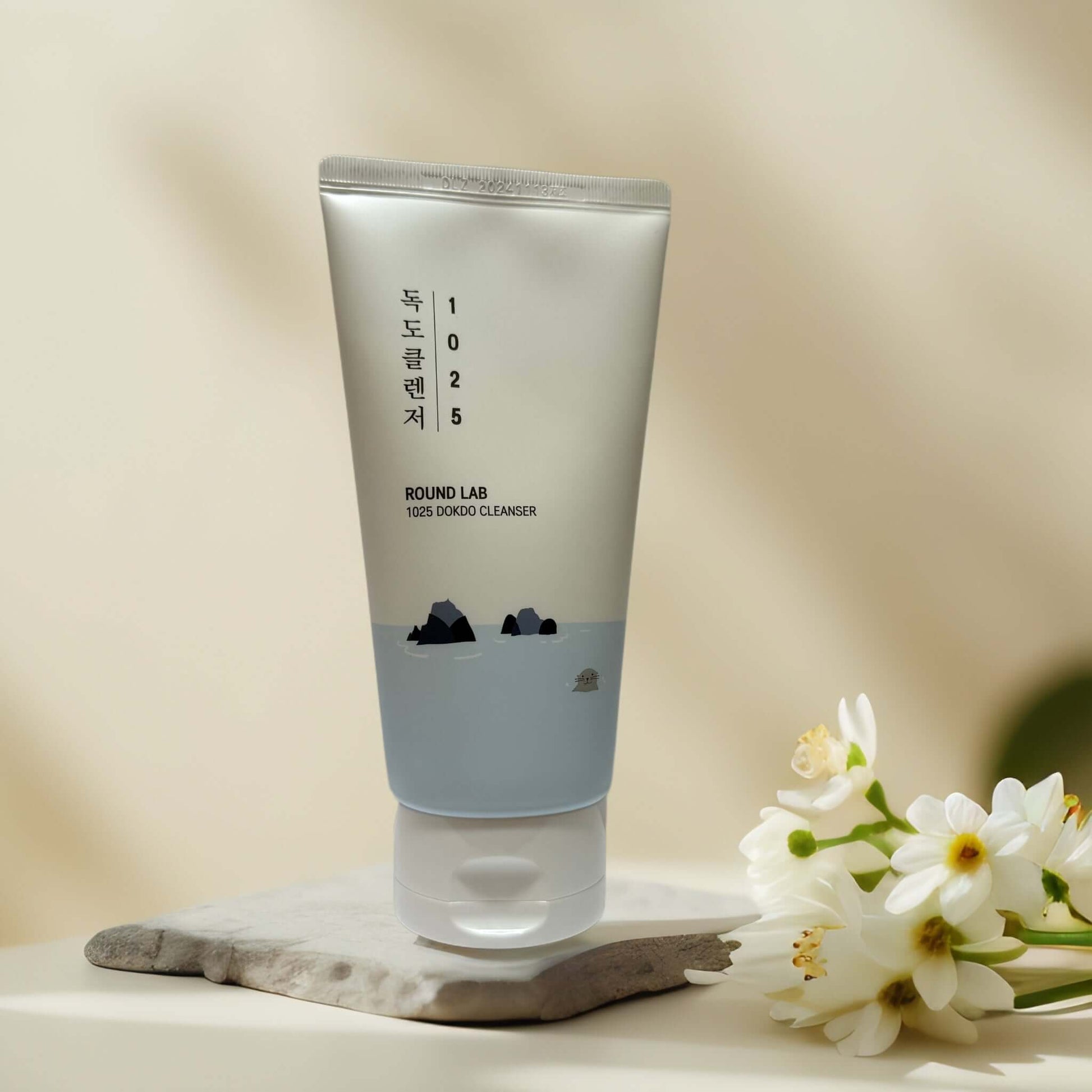 Round Lab 1025 Dokdo Cleanser tube with serene background