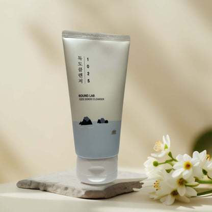 Round Lab 1025 Dokdo Cleanser tube with serene background