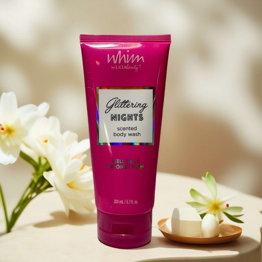 Whim Glittering Nights scented body wash 6.7 fl oz tube.