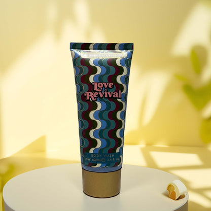 Love Revival Body Wash tube with vibrant design, 3.4 fl oz.