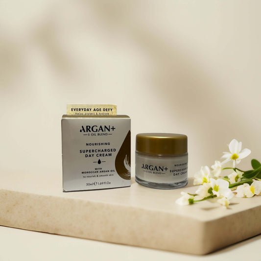 Hydrating Argan+ Supercharged Day Cream with box and flowers