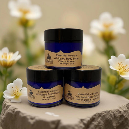 Peppermint Glow Body Butter from Queen City Skincare next to Essential Moisture Whipped Body Butters.