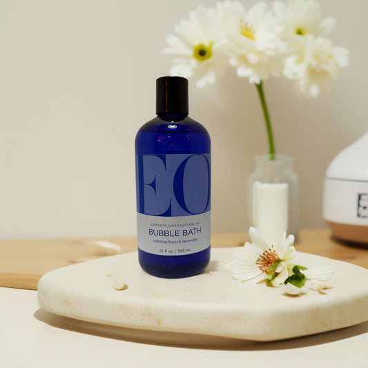 EO Bubble Bath French Lavender in blue bottle on marble.