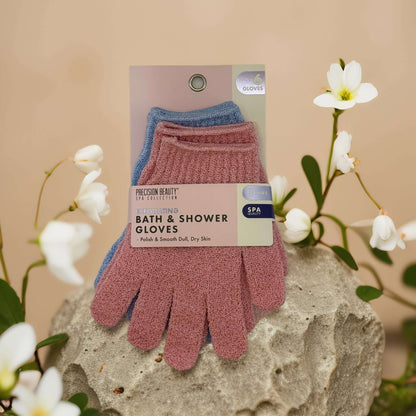 Spa exfoliating bath and shower gloves in assorted colors for polishing and smoothing dry skin.