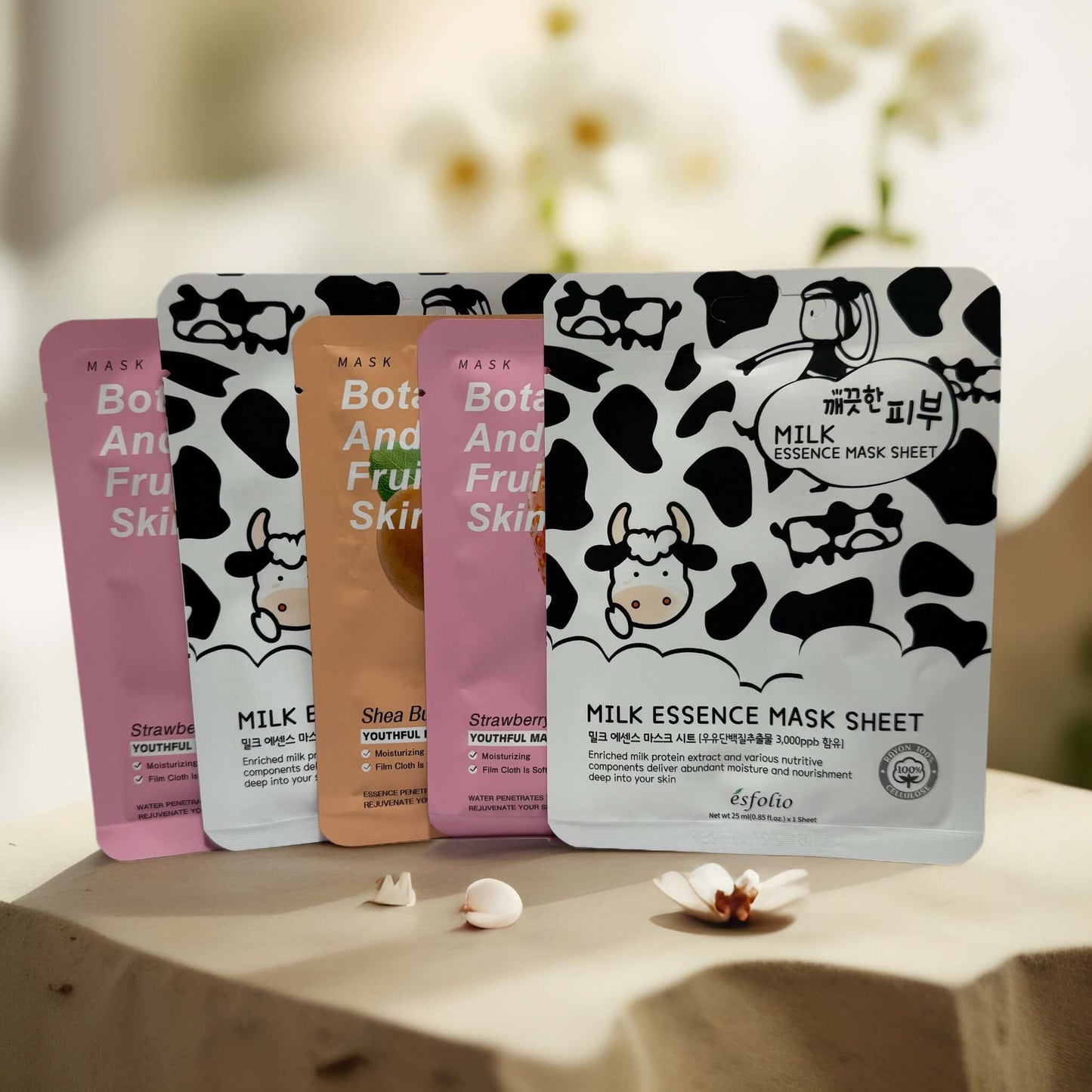 Set of sheet masks including Strawberries & Cream, Milk Essence, and more for soothing skin care.